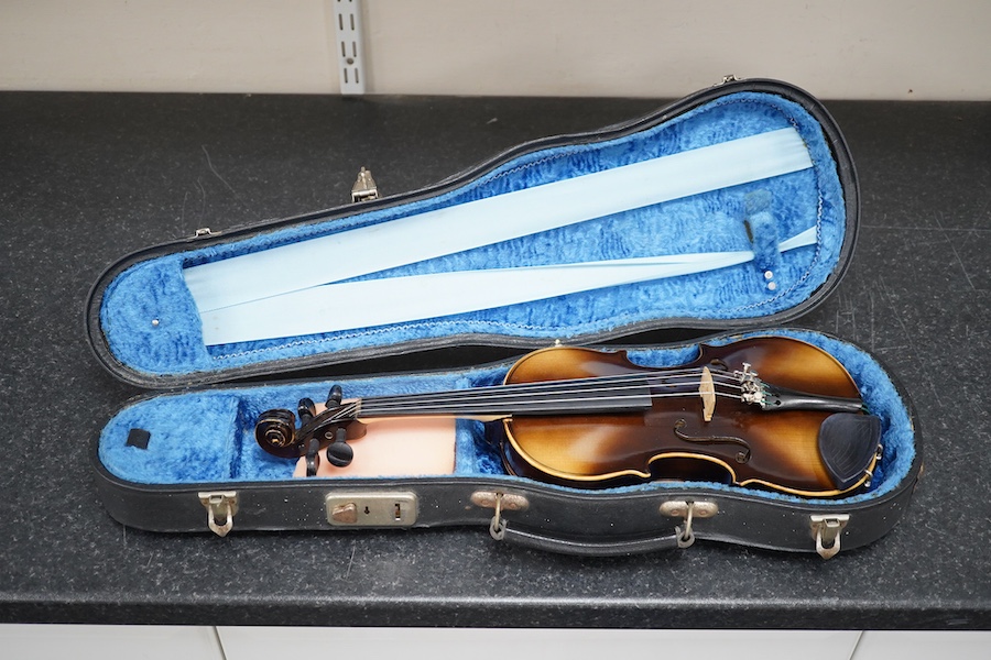 Three violins; a 3/4 Czech, a 1/2 size German and a 1/4 size Czech, all cased. Condition - fair to good